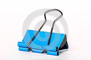 One blue paper clip made of metal, isolated with a white background