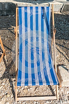 One blue sunbed on a beach