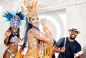 One of Brazils biggest attractions. beautiful samba dancers performing at a carnival.
