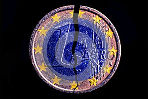 One broken euro coin close up photo
