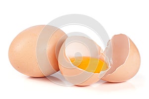 One brown egg and broken egg isolated on white background