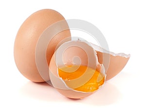 One brown egg and broken egg isolated on white background