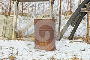 One brown old rusty metal barrel