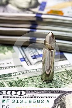 One bullet on american dollars background