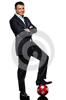 One business man standing foot on soccer ball