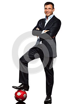 One business man standing foot on soccer ball