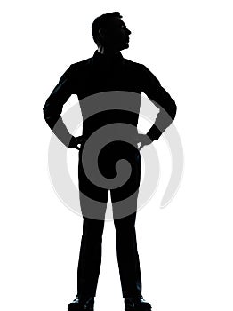 One business man standing hands on hips silhouette photo