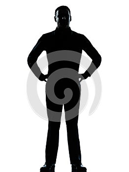 One business man standing hands on hips silhouette