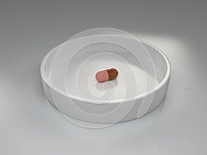 One capsule in a laboratory dish