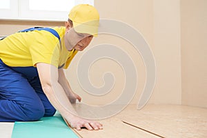 Cork worker at flooring work