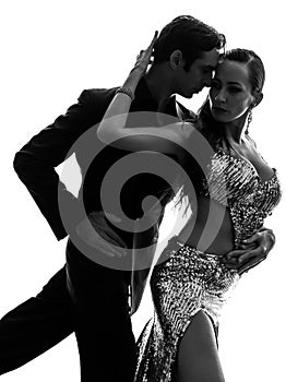 Couple man woman ballroom dancers tangoing silhouette photo