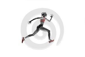 One caucasian woman running on white background