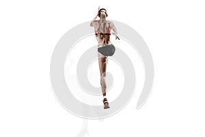 One caucasian woman running on white background