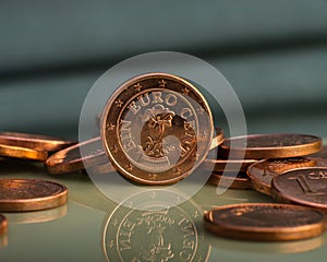 One cent coin is on coins. Euro money.
