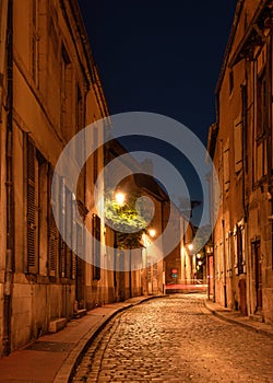 One of the charming streets of Beaune by night, France