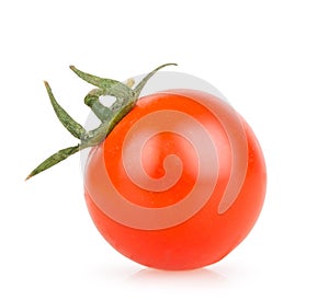 One cherry tomato on a white background