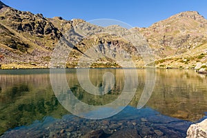 One of the clear water lake of the Estanys de Tristaina, Pyrenees, Andorra