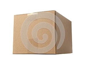 One closed cardboard box on white background