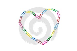 One colorful heart from paperclips on the white