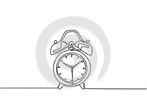 One continuous line drawing of classic analog desk alarm clock with big ring bell to tell the time. Table timepiece concept.