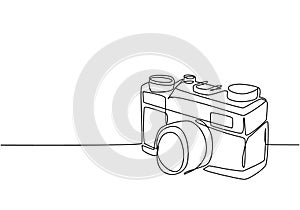 One continuous line drawing of old vintage analog pocket camera, side view. Retro classic photography equipment concept single