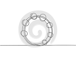 One continuous line drawing of round circle tambourine. Dynamic percussion music instruments concept single line draw graphic photo