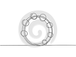 One continuous line drawing of round circle tambourine. Dynamic percussion music instruments concept single line draw graphic