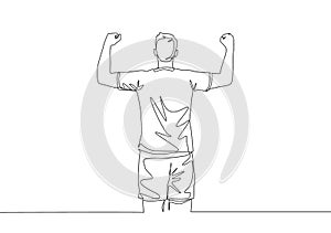 One continuous line drawing of sporty young soccer player raises his fist hands up to the sky emotionally on field. Match goal