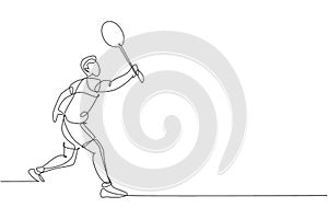 One continuous line drawing of young badminton player hit shuttlecock with racket. Competitive sport concept. Dynamic single line