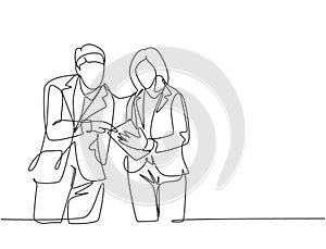 One continuous line drawing of young happy male and female marketing manager discussing sales progress on tablet phone. Online