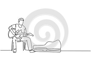 One continuous line drawing of young happy male guitarist sitting and busking by playing guitar on uptown road. Street musician