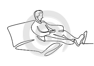 One continuous line drawing of young happy teenager man take a rest by lying down at sofa couch while relaxing his body. Enjoying