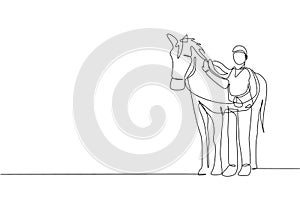 One continuous line drawing of young horse rider man rubbing and stroking horsehair at stable. Equine care. Equestrian sport