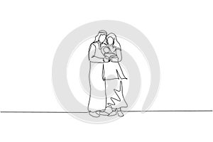 One continuous line drawing of young Islamic dad and mom standing and hugging their sleepy baby. Arabian Muslim happy family