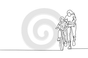 One continuous line drawing of young mother help her daughter learning to ride a bicycle at countryside together. Parenthood