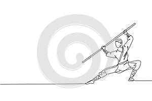 One continuous line drawing young shaolin monk man practice kung fu using long staff at temple ground. Traditional Chinese