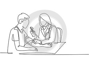 One continuous single line drawing of young female doctor check the patient`s blood pressure and pulse rate at hospital. Medical