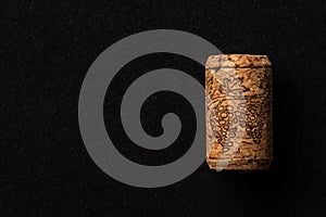 One cork stopper for wine bottle over black background