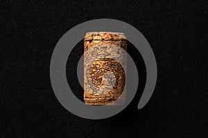 One cork stopper for wine bottle over black background