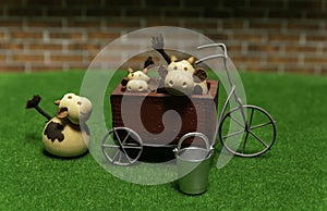 One Cow on green grass and two Cows in the tricycle with steel bucket of water