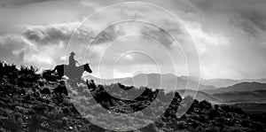 One cowboy horse Ridge Rider Silhouetted