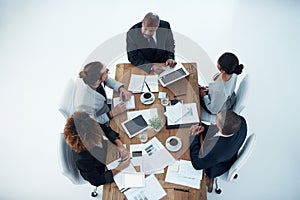 One of the crucial characteristics of effective teamwork is synergy. High angle shot of a group of businesspeople having