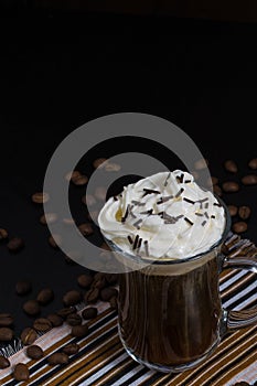 One cup of coffee with whipped cream and chocolate decoration