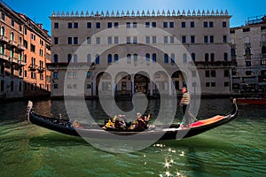 One day in the life of a gondolier. View of the Fondaco Dei Tedeschi. Venice. Italy