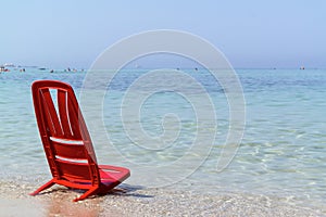 One day at the sea with the red chair
