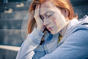 One depressed young woman feeling negative feelings