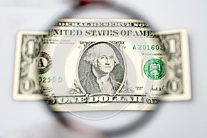 One dollar banknote through a magnifying lens.