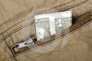 One dollar bill in a pocket