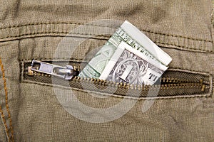 One dollar bill in a pocket