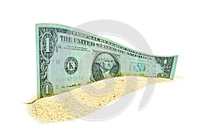 One Dollar Bill in a Sandpile Isolated on White Background